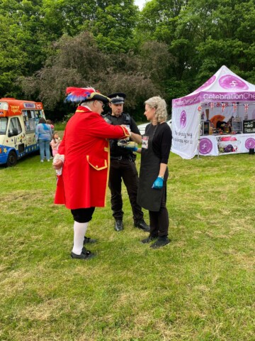 Towncrier John Housley with Pc Matt Cook and Celebration Cheeses