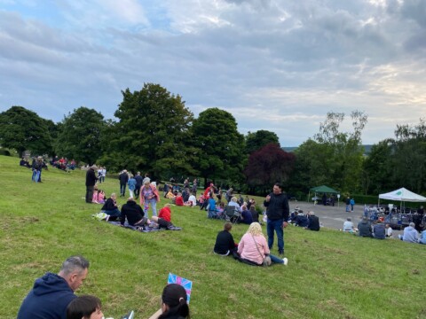 View of crowds looking down the hill in Chapeltown park 