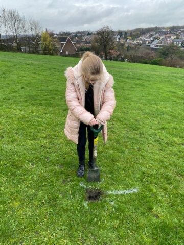 Girl pictured digging the ground
