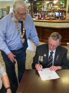 Cllr John Housley signing the Armed forces Covenant