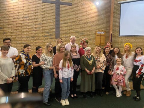 Photo taken in Chapeltown Methodist Church pictured Chairman John Housley in centre with group of attendees from Ukrainian evening 