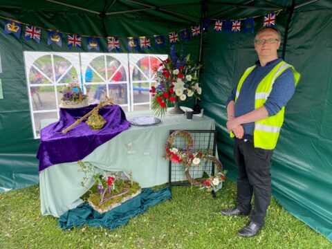 Parish Clerk Andrew Towlerton with Capelle floristry display