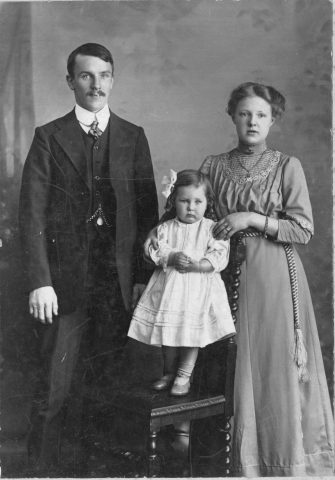 Old photo from 1912 of the Marshall Family, mum, dad and  daughter.
