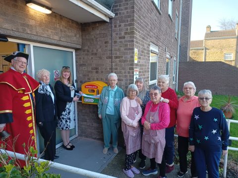 Cllr Susan Davidson (Chairman of Ecclesfield Parish Council), Councillor John Housley (Ecclesfield Town Crier), Councillor Rob Reiss (taking photo) and Anne Willey (Wortley Rotary Club of Wortley) together with residents unveiling the new defibrillator at Eva Ratcliffe House, Ecclesfield